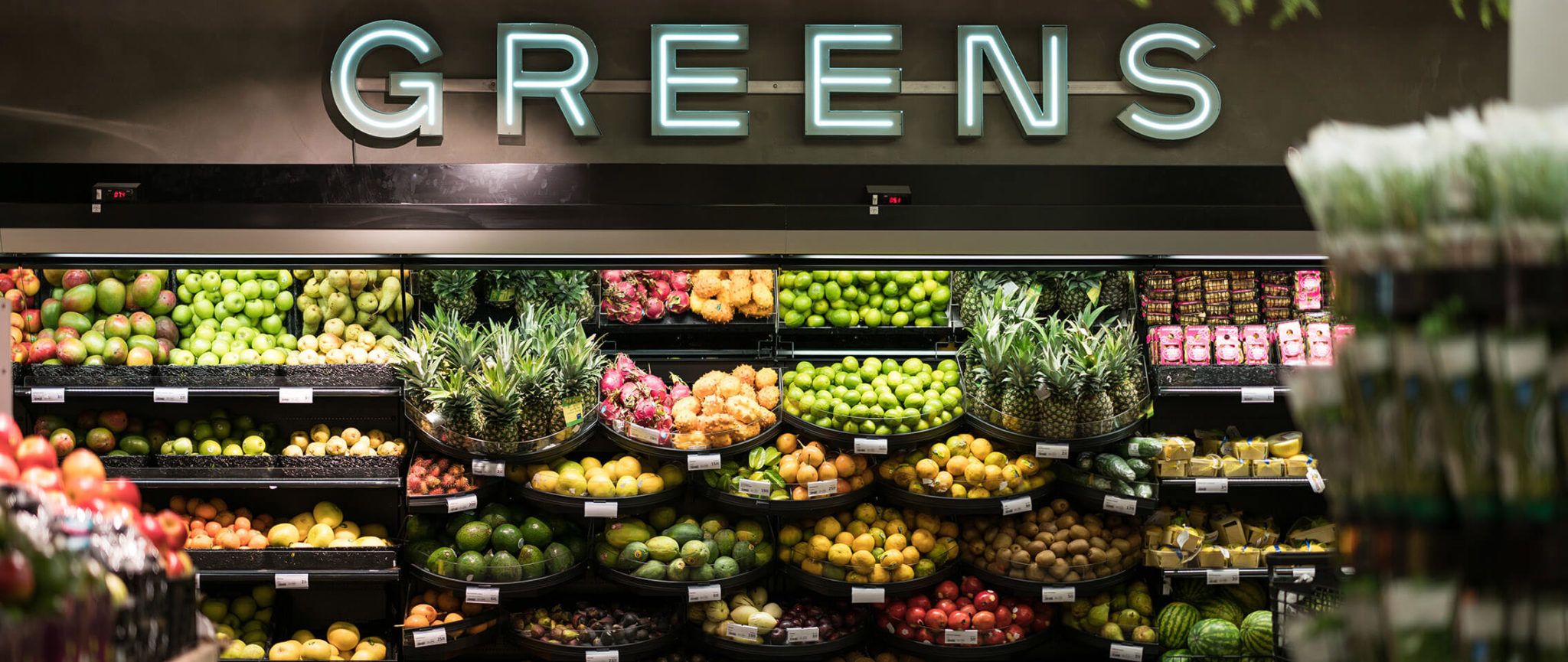 Grocery store shelf with fruits and vegetables