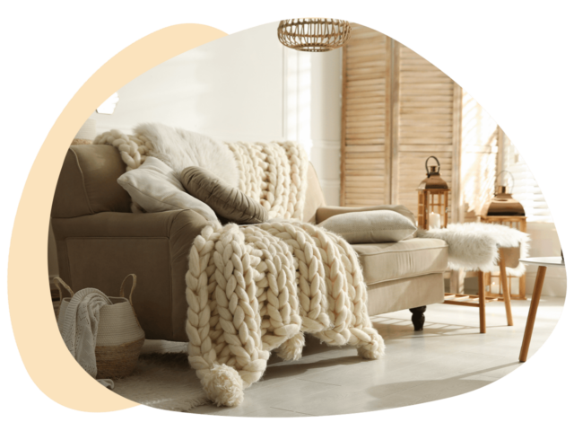 Sofa with pillows and blanket